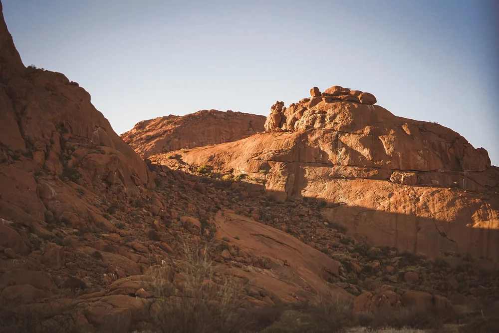 Rider tackling a rocky pass through Kaokoland, Namibia